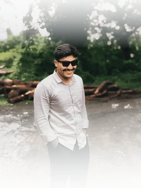 freelance digital marketer in kerala standing on a muddy road in a forest
